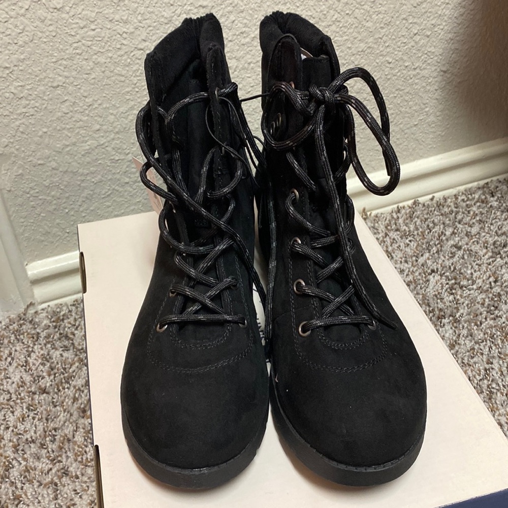 Black combat boots. New with tag.